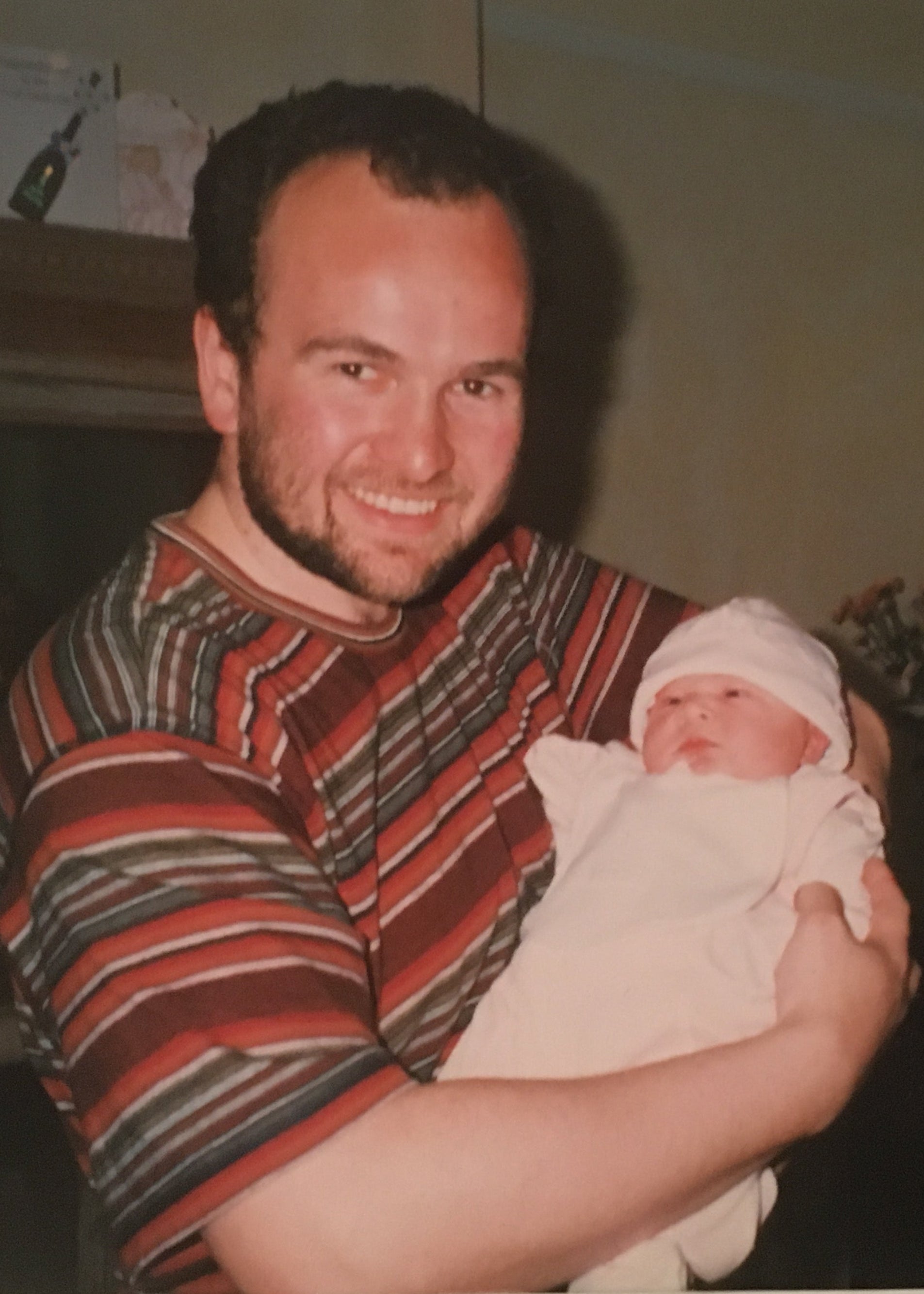 Dr Bruce Whittingham holding his first newborn baby ariana
